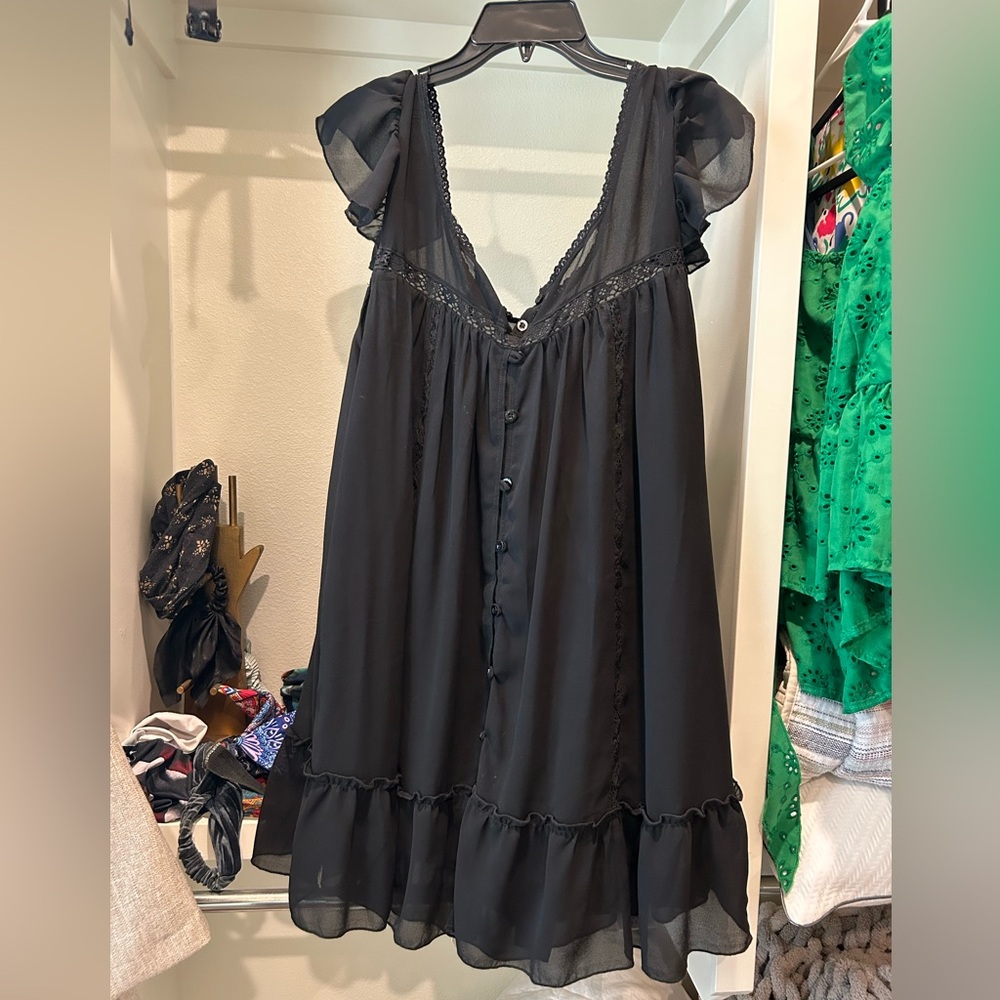 Black ruffle tunic style tank top.